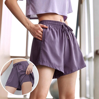 Person wearing purple athletic shorts with a close-up inset, standing indoors.