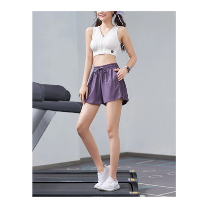 Woman in athletic wear standing on a treadmill