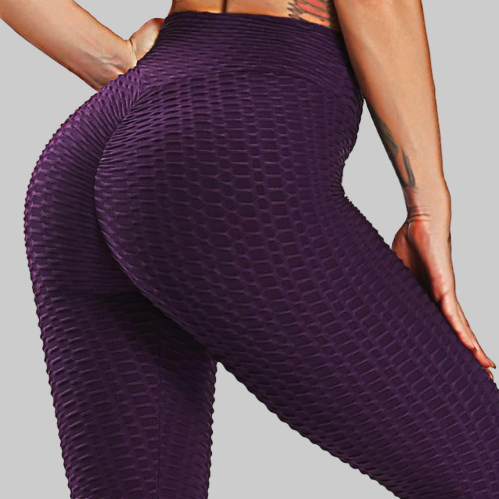 Purple textured leggings worn by a person on a white background