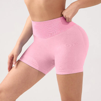  wearing pink high-waisted shorts on a