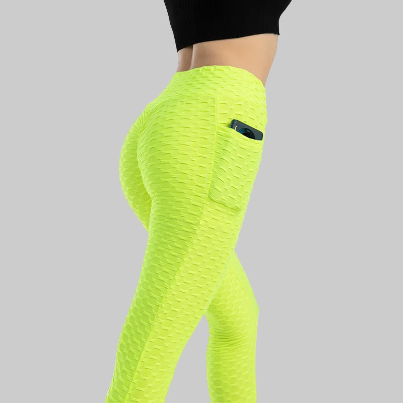 Neon green leggings with a pocket on a white background