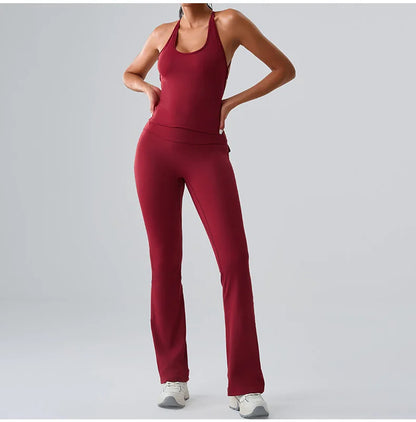 Women's red workout set with high-waist leggings and matching sports bra, designed for comfort during yoga, gym, and training session