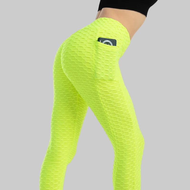 Neon green leggings with a brand logo on a white background