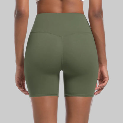 Green athletic shorts worn by a person on a white background