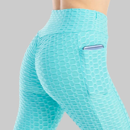 Teal patterned leggings with a pocket on a white background