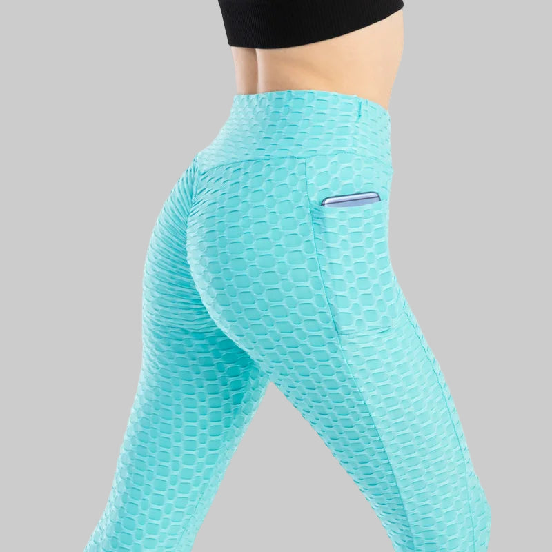 Turquoise leggings with a textured pattern on a white background