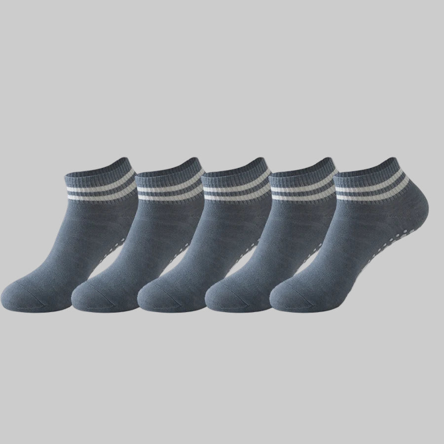 Set of five pairs of gray ankle socks with white stripes on a white background
