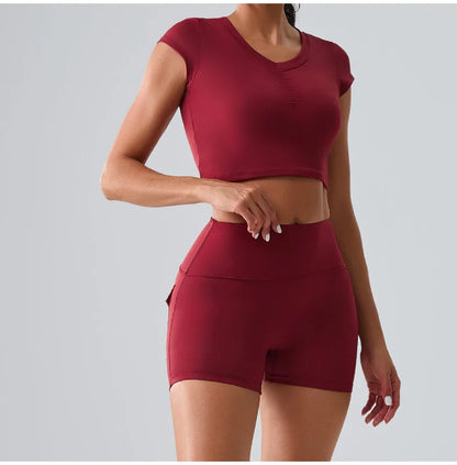 Women's red workout set with pocketed t-shirt and shorts, designed for running, yoga, and stylish comfort