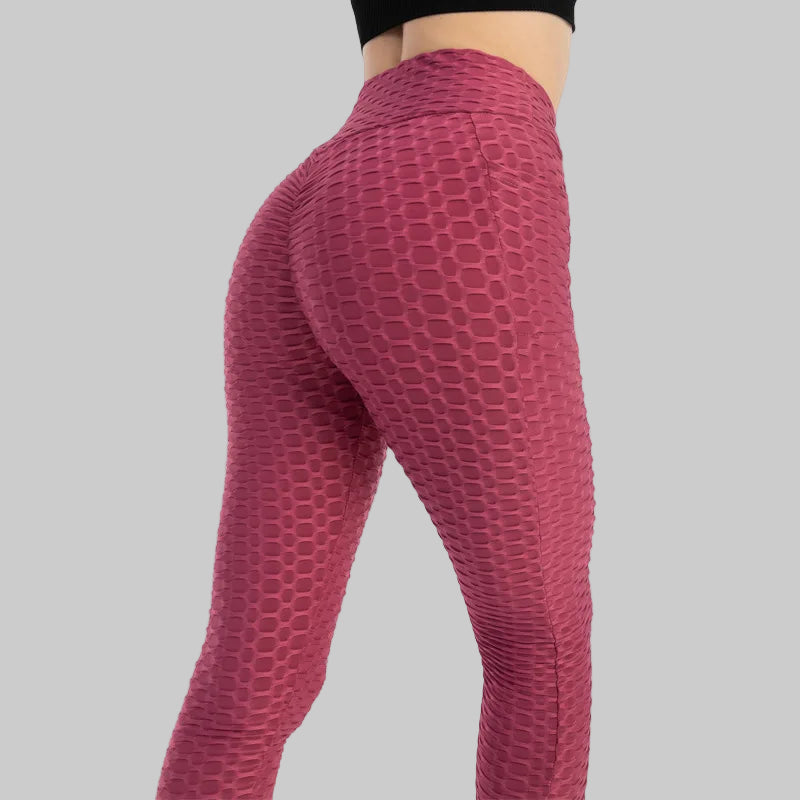 Maroon textured leggings on a white background