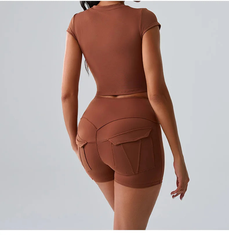 Women's brown workout set with pocketed t-shirt and shorts, designed for gym, Pilates, and all-day comfort