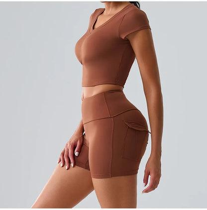 Women's brown sporty set featuring t-shirt and shorts with pockets, perfect for yoga, running, and workout sessions