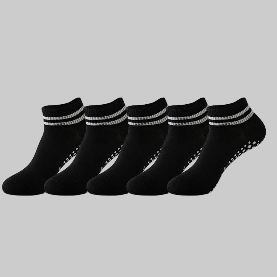 Set of six black ankle socks with white stripes on a white background