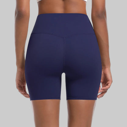 Navy blue athletic shorts worn by a person on a white background