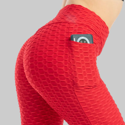 Red textured leggings with a pocket on a white background