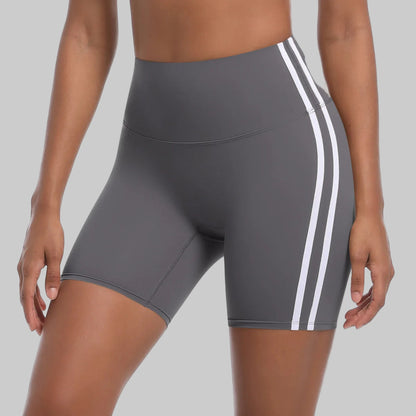Gray athletic shorts with white stripes on a white background