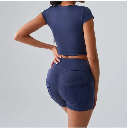 Women's stylish workout set with pocketed t-shirt and shorts, designed for yoga, gym, and comfortable training sessions