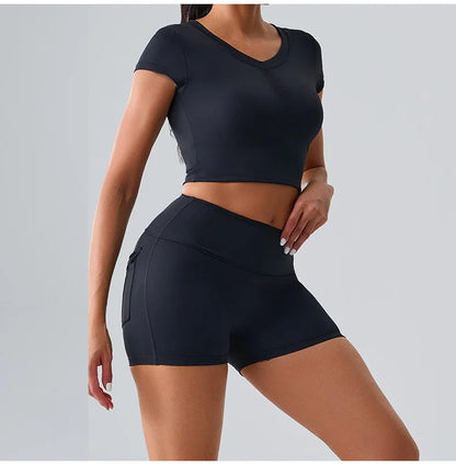 Women's black sporty set with pocketed t-shirt and shorts, designed for comfortable and stylish workouts, yoga, and gym sessions
