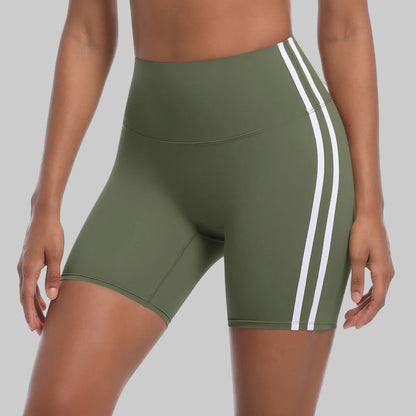 Green athletic shorts with white stripes on a white background