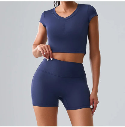 Women's blue sporty set featuring shorts and a t-shirt with pockets, perfect for yoga, running, and workout comfort