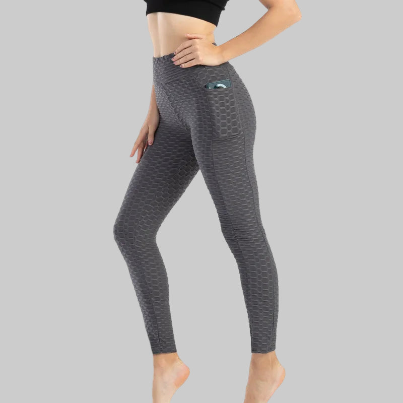 Gray leggings with a textured pattern on a white background