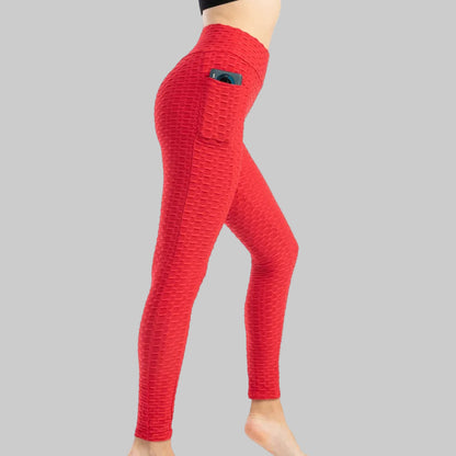Red textured leggings with a pocket on a white background
